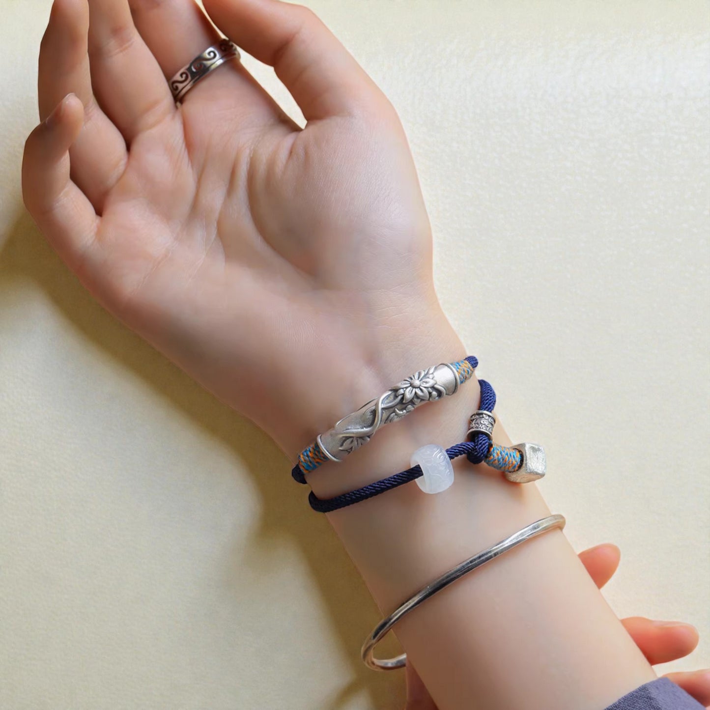 s999 Silver Flower Blessing Charm Hand Woven Unisex Rope Bracelet